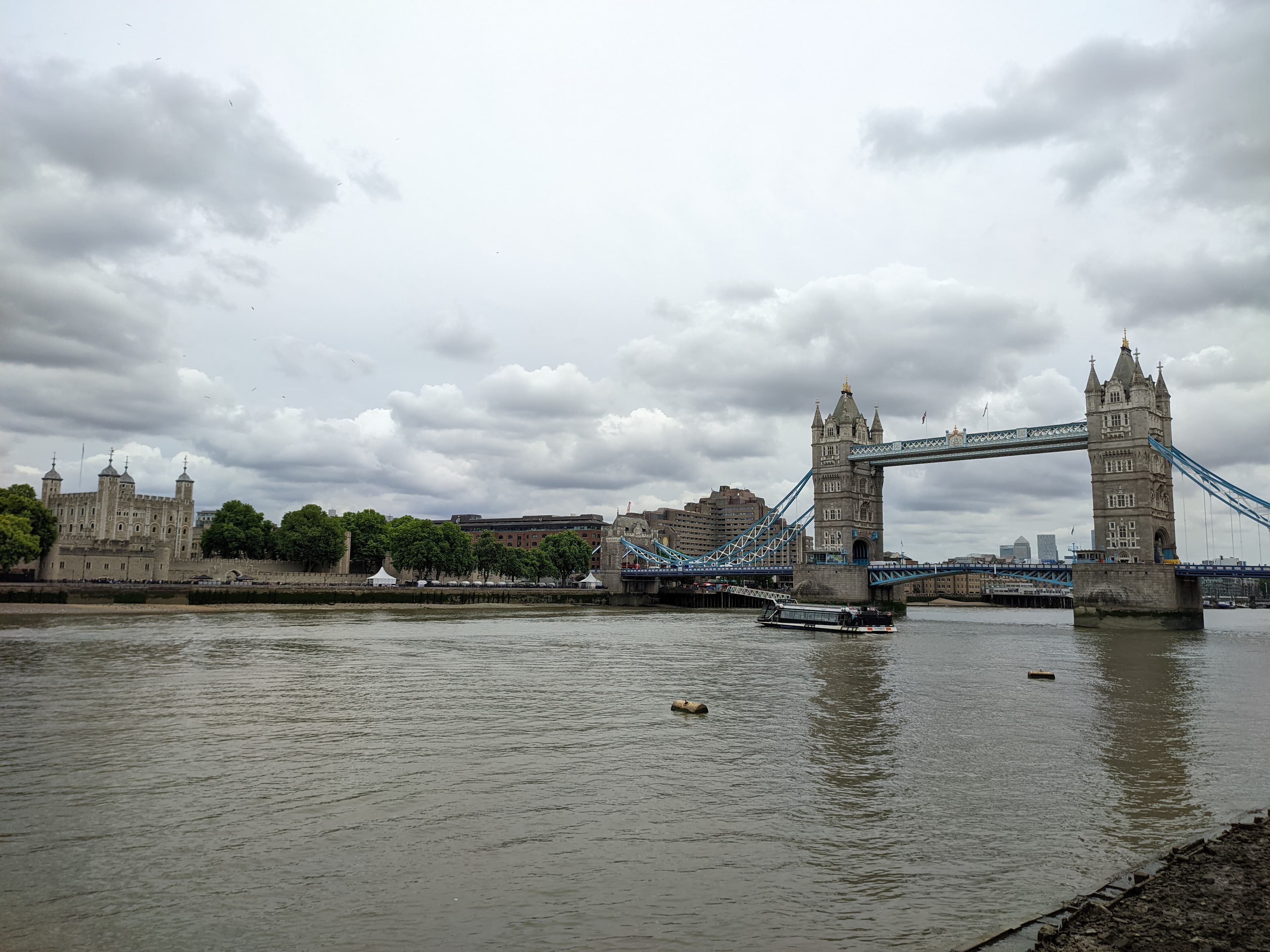 Runners crossing Tower Bridge during the London Marathon, with the Tower of London and Thames behind